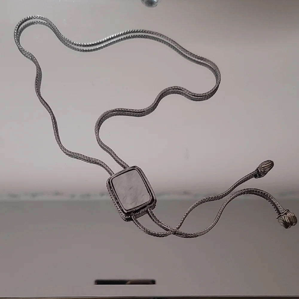 NWOT Silver Bolo Tie With Mother Of Perl Accent.